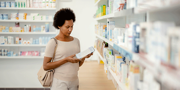 Woman in pharmacy looking at options