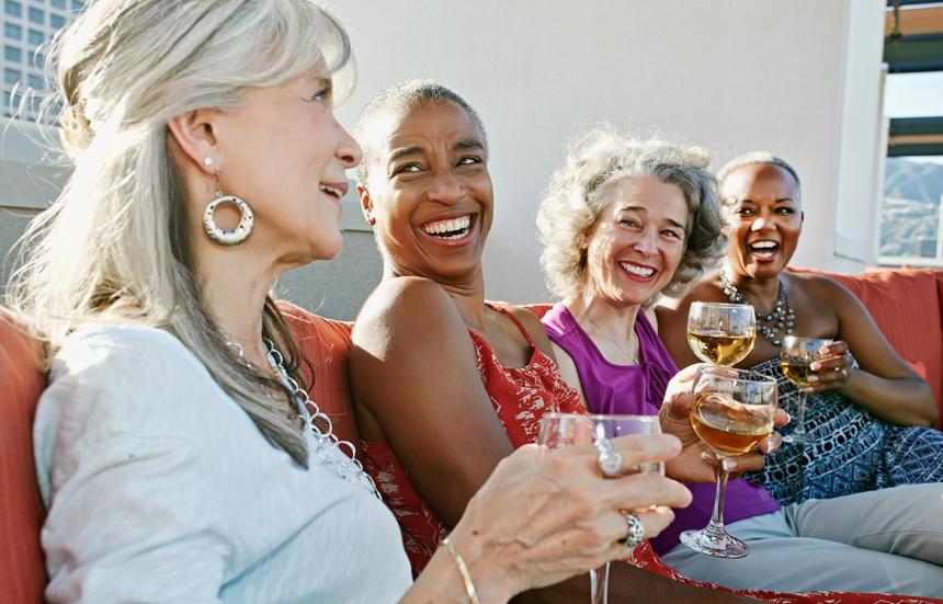 4 women drinking wine