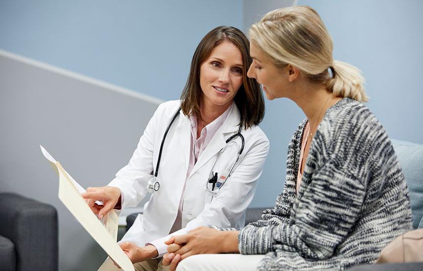 Female doctor talking to female patient