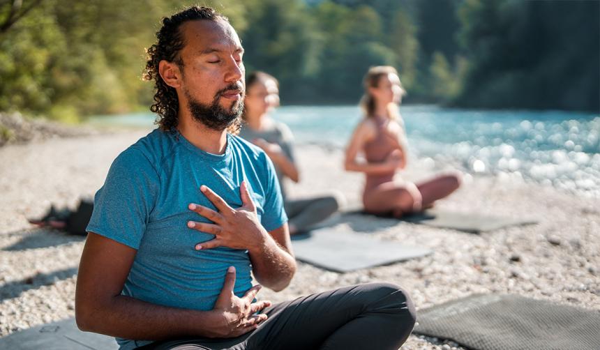 Three people practicing Awareness of Breath Meditation