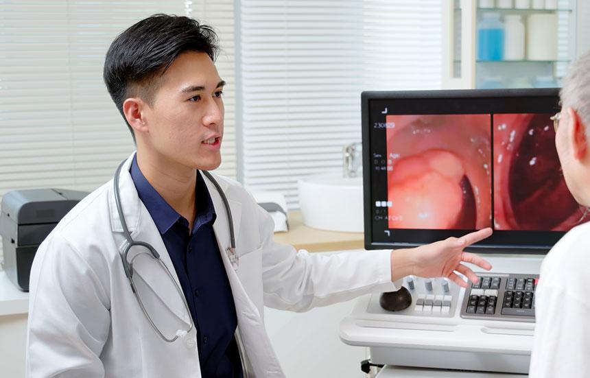 Doctor explaining colon screening to patient