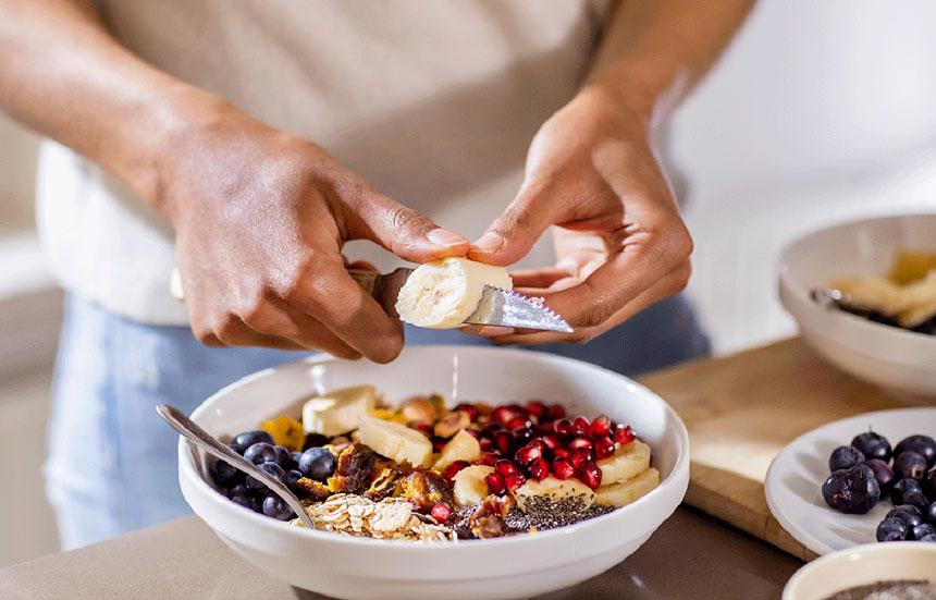 Man preparing healthy snack bowl