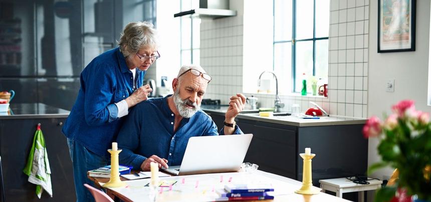 man and woman searching online for a primary care doctor