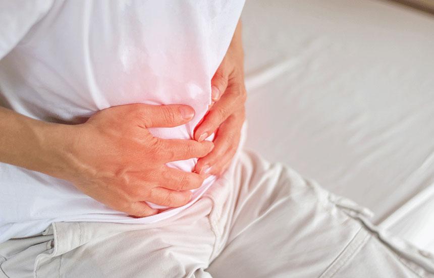 Man holding his stomach in pain