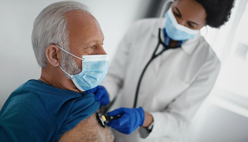 Elderly man having his heart checked by a doctor