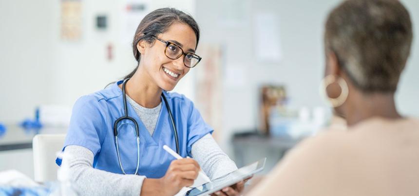 nurse practitioner talking to patient