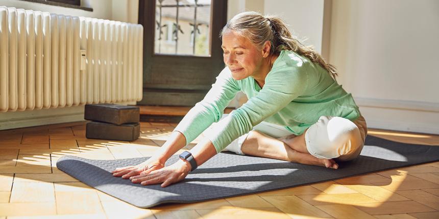 Woman in her early 60s practicing yoga. Exercise is one way to keep practicing prevention as we age.