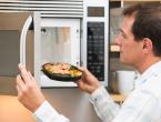 Man microwaving processed meal