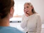 Older woman talking to doctor