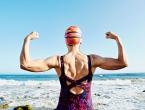 Older woman exercising at beach