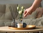 Reeds, oil, candle, flower in vase