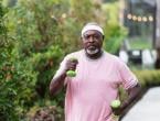 Man walking with weights in his hands