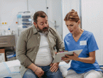 Overweight man talking to physician