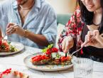 Two people eating a healthy meal.