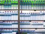 Supermarket shelves with bottles of water