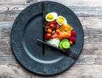 Illustration of intermittent fasting. Plate with food in the shape of a clock.