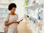 Woman in pharmacy looking at options