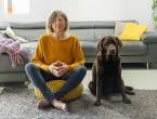 A woman and her dog practicing mindful meditation.