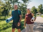 Middle age couple going to outdoor yoga