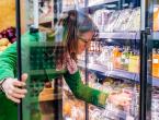 woman looking at fruit options in the grocery store