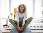 woman practicing yoga at home