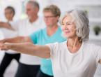 Four people doing stretching exercises.